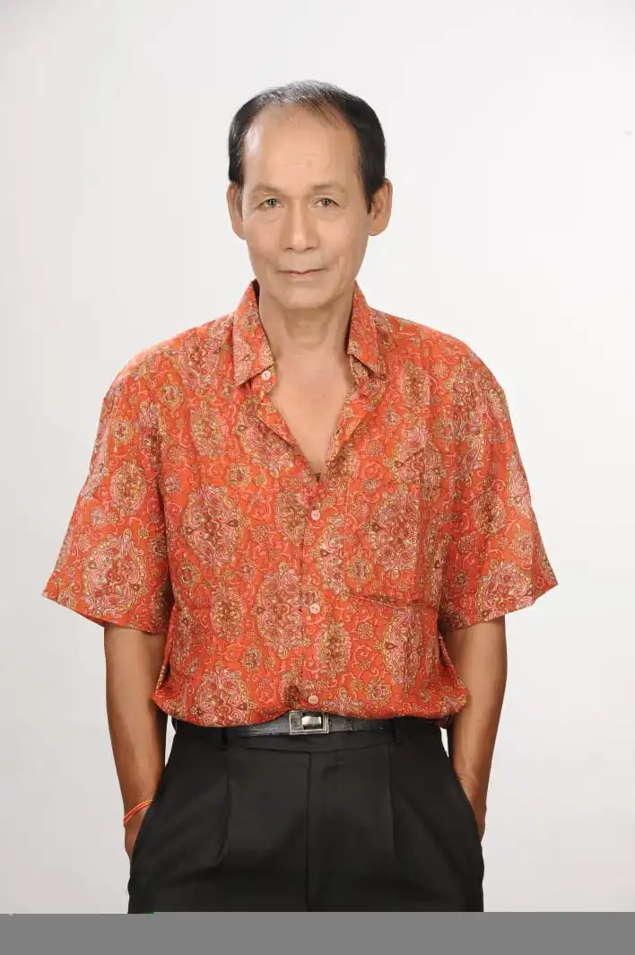 Kanak Lal Swargiary playing harmonium